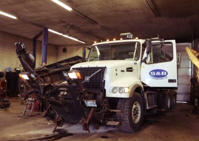 White S & B Construction dump truck